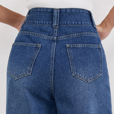 اتجاه الخريف والشتاء: جينز عالي الخصر بزر مزدوج بل...