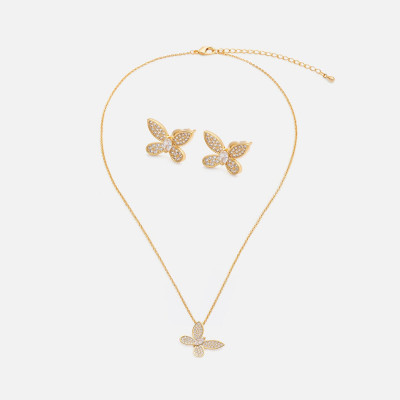 ‎ طقم نسائي بتصميم أنيق بلون ذهبي