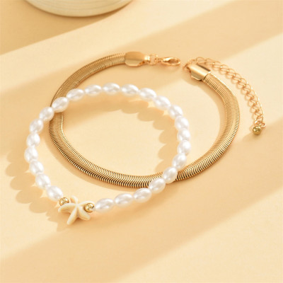 خلخال سوارين الأول ناعم وأنيق والآخر مزين بنجم الب...