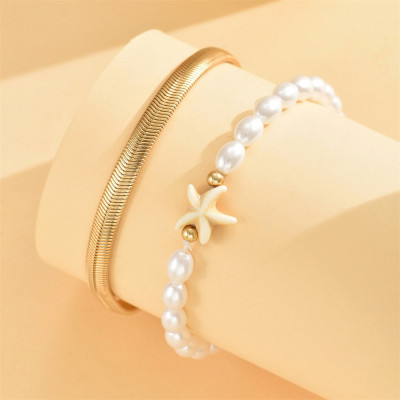 خلخال سوارين الأول ناعم وأنيق والآخر مزين بنجم الب...