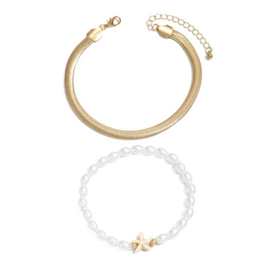 خلخال سوارين الأول ناعم وأنيق والآخر مزين بنجم الب...