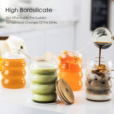 كوب زجاجي مع ماصة مناسب للقهوة والعصير