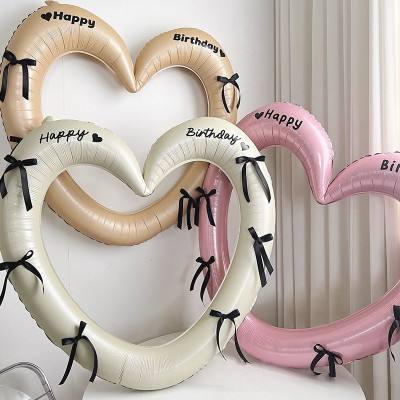 Heart-shaped picture frame balloon for a happy birthday with bow-shaped stickers for decorating birthday parties and weddings