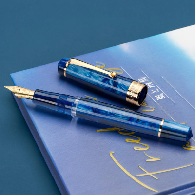 Acrylic style ink pen with a gold clip